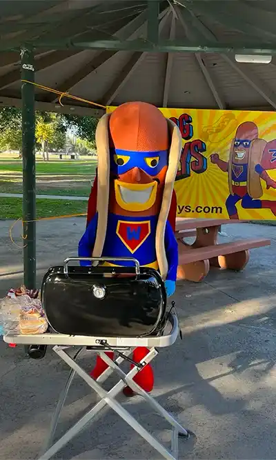 About Us 1 hot dog with mustard and relish in a bun